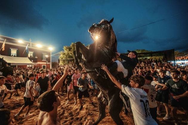 July 24, 2026, Es Castell, Menorca Balearic Islands, Spain: A caixer, or horse rider, rears his horse amid a cheering crowd during the traditional Jaleo at the Sant MartoÂ­ Festival in Es Castell. Es Castell Spain - ZUMAo105 20260724_fap_o105_007 Copyright: xMatthiasxOesterlex