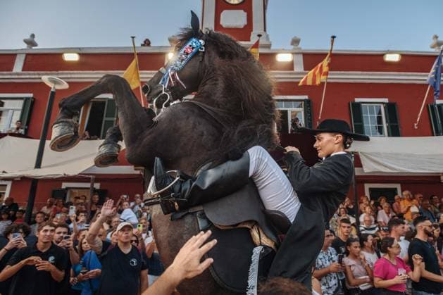 July 24, 2026, Es Castell, Menorca Balearic Islands, Spain: A caixer, or horse rider, rears his horse amid a cheering crowd during the traditional Jaleo at the Sant MartoÂ­ Festival in Es Castell. Es Castell Spain - ZUMAo105 20260724_fap_o105_010 Copyright: xMatthiasxOesterlex