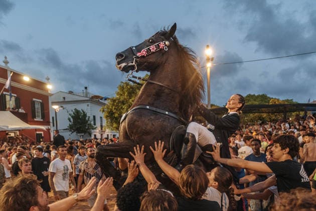 July 24, 2026, Es Castell, Menorca Balearic Islands, Spain: A caixer, or horse rider, rears his horse amid a cheering crowd during the traditional Jaleo at the Sant MartoÂ­ Festival in Es Castell. Es Castell Spain  - ZUMAo105 20260724_fap_o105_019 Copyright: xMatthiasxOesterlex