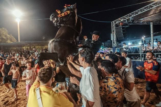 July 24, 2026, Es Castell, Menorca Balearic Islands, Spain: A caixer, or horse rider, rears his horse amid a cheering crowd during the traditional Jaleo at the Sant MartoÂ­ Festival in Es Castell. Es Castell Spain  - ZUMAo105 20260724_fap_o105_023 Copyright: xMatthiasxOesterlex