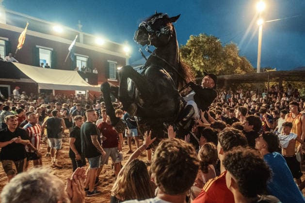 July 24, 2026, Es Castell, Menorca Balearic Islands, Spain: A caixer, or horse rider, rears his horse amid a cheering crowd during the traditional Jaleo at the Sant MartoÂ­ Festival in Es Castell. Es Castell Spain  - ZUMAo105 20260724_fap_o105_024 Copyright: xMatthiasxOesterlex