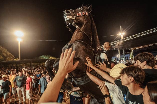 July 24, 2026, Es Castell, Menorca Balearic Islands, Spain: A caixer, or horse rider, rears his horse amid a cheering crowd during the traditional Jaleo at the Sant MartoÂ­ Festival in Es Castell. Es Castell Spain  - ZUMAo105 20260724_fap_o105_028 Copyright: xMatthiasxOesterlex