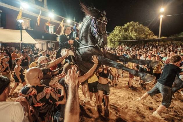 July 24, 2026, Es Castell, Menorca Balearic Islands, Spain: A caixer, or horse rider, rears his horse amid a cheering crowd during the traditional Jaleo at the Sant MartoÂ­ Festival in Es Castell. Es Castell Spain - ZUMAo105 20260724_fap_o105_013 Copyright: xMatthiasxOesterlex