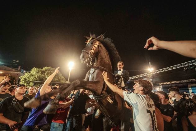 July 24, 2026, Es Castell, Menorca Balearic Islands, Spain: A caixer, or horse rider, rears his horse amid a cheering crowd during the traditional Jaleo at the Sant MartoÂ­ Festival in Es Castell. Es Castell Spain - ZUMAo105 20260724_fap_o105_014 Copyright: xMatthiasxOesterlex
