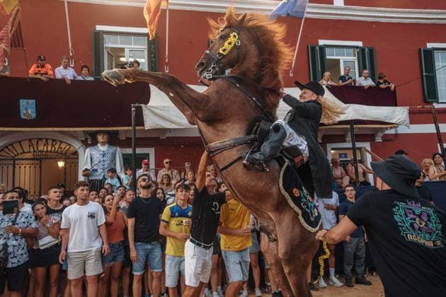 July 24, 2026, Es Castell, Menorca Balearic Islands, Spain: A caixer, or horse rider, rears his horse amid a cheering crowd during the traditional Jaleo at the Sant MartoÂ­ Festival in Es Castell. Es Castell Spain - ZUMAo105 20260724_fap_o105_017 Copyright: xMatthiasxOesterlex