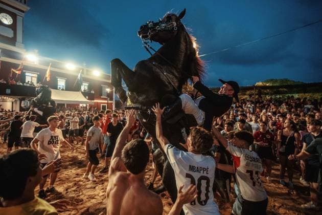 July 24, 2026, Es Castell, Menorca Balearic Islands, Spain: A caixer, or horse rider, rears his horse amid a cheering crowd during the traditional Jaleo at the Sant MartoÂ­ Festival in Es Castell. Es Castell Spain - ZUMAo105 20260724_fap_o105_021 Copyright: xMatthiasxOesterlex