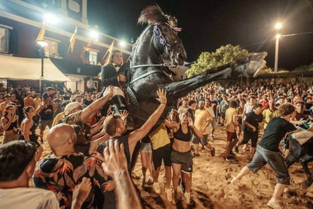 July 24, 2026, Es Castell, Menorca Balearic Islands, Spain: A caixer, or horse rider, rears his horse amid a cheering crowd during the traditional Jaleo at the Sant MartoÂ­ Festival in Es Castell. Es Castell Spain - ZUMAo105 20260724_fap_o105_026 Copyright: xMatthiasxOesterlex