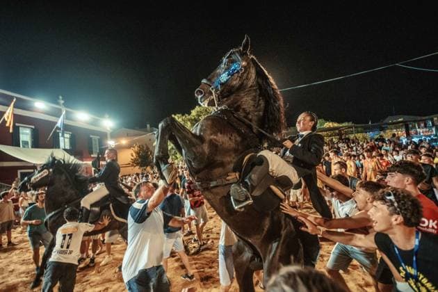 July 24, 2026, Es Castell, Menorca Balearic Islands, Spain: A caixer, or horse rider, rears his horse amid a cheering crowd during the traditional Jaleo at the Sant MartoÂ­ Festival in Es Castell. Es Castell Spain - ZUMAo105 20260724_fap_o105_029 Copyright: xMatthiasxOesterlex