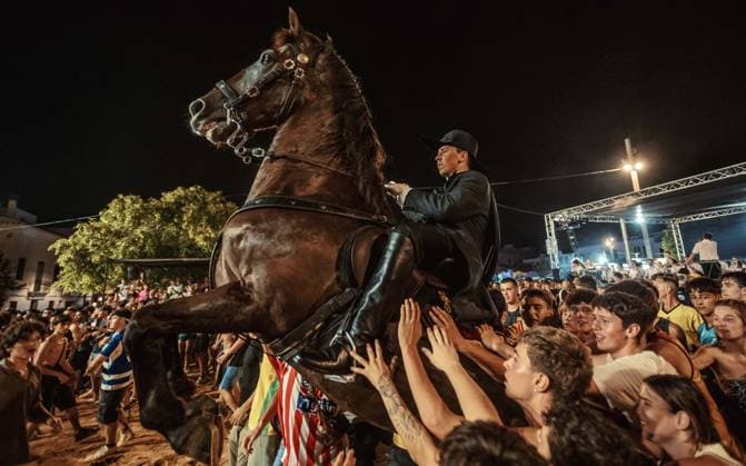 July 24, 2026, Es Castell, Menorca Balearic Islands, Spain: A caixer, or horse rider, rears his horse amid a cheering crowd during the traditional Jaleo at the Sant MartoÂ­ Festival in Es Castell. Es Castell Spain - ZUMAo105 20260724_fap_o105_030 Copyright: xMatthiasxOesterlex