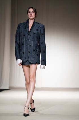 July 24, 2026, Madrid, Spain: A model walks the runway wearing a design by Romanian designers during Momad Fashion Week de Madrid in IFEMA Madrid Spain - ZUMAs197 20260724_aaa_s197_171 Copyright: xAtilanoxGarciax
