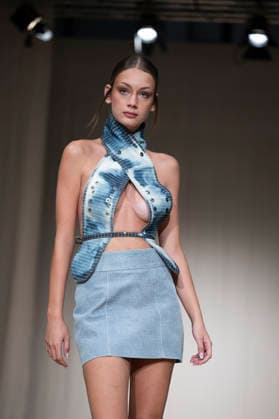 July 24, 2026, Madrid, Spain: A model walks the runway wearing a design by Romanian designers during Momad Fashion Week de Madrid in IFEMA Madrid Spain - ZUMAs197 20260724_aaa_s197_230 Copyright: xAtilanoxGarciax