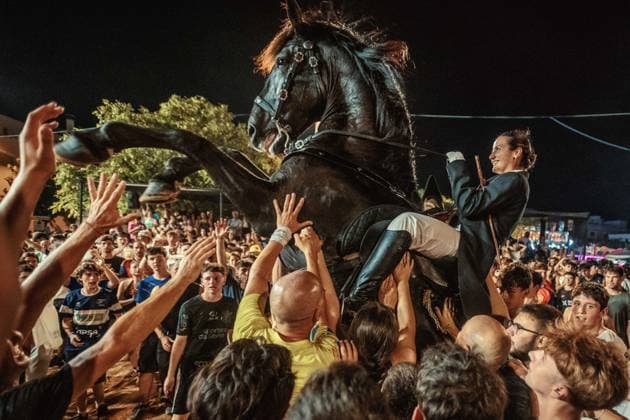 July 24, 2026, Es Castell, Menorca Balearic Islands, Spain: A caixer, or horse rider, rears his horse amid a cheering crowd during the traditional Jaleo at the Sant MartoÂ­ Festival in Es Castell. Es Castell Spain - ZUMAo105 20260724_fap_o105_022 Copyright: xMatthiasxOesterlex