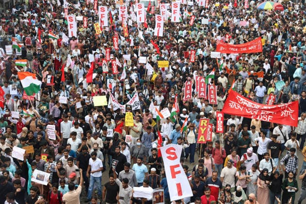 July 24, 2026, Kolkata, West Bengal, India: Activists of the Students Federation of India (SFI) and supporters of Cockroach Janta Party(CJP) participate in a protest march condemning a police baton charge on demonstrators and demanding the resignation of India s Education Minister, Dharmendra Pradhan, over alleged examination irregularities, in Kolkata, India, July 24, 2026. Kolkata India - ZUMAd217 20260724_zip_d217_016 Copyright: xRupakxDexChowdhurix