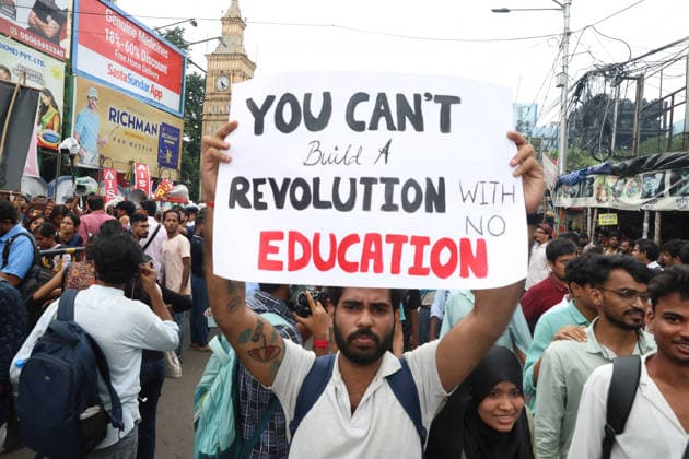 July 24, 2026, Kolkata, West Bengal, India: Activists of the Students Federation of India (SFI) and supporters of Cockroach Janta Party(CJP) participate in a protest march condemning a police baton charge on demonstrators and demanding the resignation of India s Education Minister, Dharmendra Pradhan, over alleged examination irregularities, in Kolkata, India, July 24, 2026. Kolkata India  - ZUMAd217 20260724_zip_d217_022 Copyright: xRupakxDexChowdhurix