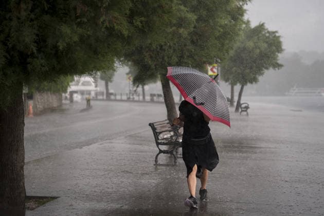 Heavy summer rainfall affects parts of Istanbul ISTANBUL, TURKIYE – JULY 25: A pedestrian walks with an umbrella as heavy summer rain falls along the Bosphorus waterfront in Istanbul, Turkiye, on July 25, 2026. Dark clouds covered parts of the city during the rainfall. Arife Karakum Anadolu Istanbul Turkey. Editorial use only. Please get in touch for any other usage.  Copyright: x2026xAnadoluxArifexKarakumx