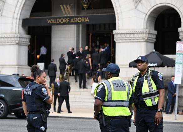 (260725) -- WASHINGTON, July 25, 2026 -- Police officers stand guard outside the Waldorf Astoria hotel where the White House Correspondents Association Dinner is held in Washington, D.C., the United States, July 24, 2026. The rescheduled 2026 White House Correspondents Association Dinner was held at the Waldorf Astoria hotel here on Friday. The dinner was rescheduled after gunshots were heard during the original event at the Washington Hilton Hotel on April 25, leading to the emergency evacuation of U.S. President Donald Trump and the arrest of the suspect. ) U.S.-WASHINGTON, D.C.-WHITE HOUSE CORRESPONDENTS ASSOCIATION DINNER LixRui 