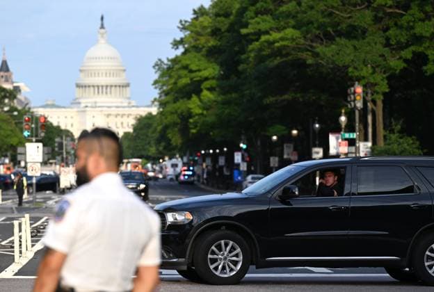 (260725) -- WASHINGTON, July 25, 2026 -- A police officer stands guard near the Waldorf Astoria hotel where the White House Correspondents Association Dinner is held in Washington, D.C., the United States, July 24, 2026. The rescheduled 2026 White House Correspondents Association Dinner was held at the Waldorf Astoria hotel here on Friday. The dinner was rescheduled after gunshots were heard during the original event at the Washington Hilton Hotel on April 25, leading to the emergency evacuation of U.S. President Donald Trump and the arrest of the suspect. ) U.S.-WASHINGTON, D.C.-WHITE HOUSE CORRESPONDENTS ASSOCIATION DINNER LixRui 
