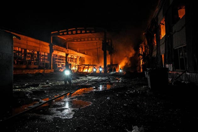 Rescuers extinguish a fire at a shopping complex caused by a Russian attack in Zaporizhzhia, Ukraine, July 25, 2026. In the early hours of Saturday, July 25, Russian troops struck the southeastern Ukrainian city with drones, igniting a fire that spread through shops and trading pavilions over an area of about 900 square metres. A 63-year-old man was injured in the drone strike. (Photo by Dmytro Smolienko Ukrinform) Russian army attacks Zaporizhzhia with drones  Copyright: xDmytroxSmolienkox