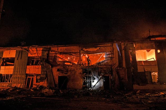 Rescuers extinguish a fire at a shopping complex caused by a Russian attack in Zaporizhzhia, Ukraine, July 25, 2026. In the early hours of Saturday, July 25, Russian troops struck the southeastern Ukrainian city with drones, igniting a fire that spread through shops and trading pavilions over an area of about 900 square metres. A 63-year-old man was injured in the drone strike. (Photo by Dmytro Smolienko Ukrinform) Russian army attacks Zaporizhzhia with drones  Copyright: xDmytroxSmolienkox