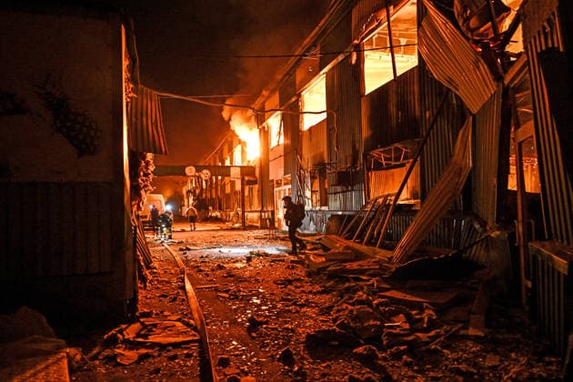 A shopping complex burns following a Russian attack in Zaporizhzhia, Ukraine, July 25, 2026. In the early hours of Saturday, July 25, Russian troops struck the southeastern Ukrainian city with drones, igniting a fire that spread through shops and trading pavilions over an area of about 900 square metres. A 63-year-old man was injured in the drone strike. (Photo by Dmytro Smolienko Ukrinform) Russian army attacks Zaporizhzhia with drones  Copyright: xDmytroxSmolienkox