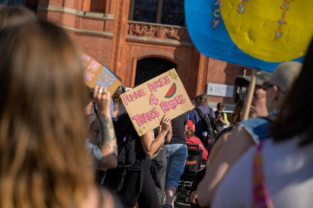July 24, 2026, Berlin, Berlin, Germany: A person holds a placard showing the support withthe Palestinians at Dyke* March 2026, on July 24 2026, in Berlin, Germany. Thousands of demonstrators marched in the streets of Berlin s City Center and Kreuzberg districts for the annual Dyke* March just a day before the annual CSD parade and Internationalist Queer Pride Berlin Germany  - ZUMAk201 20260724_zip_k201_001 Copyright: xNikosxKanistrasx