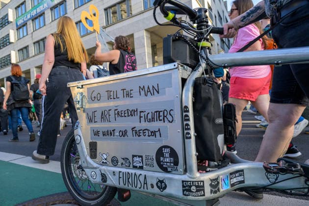 July 24, 2026, Berlin, Berlin, Germany: A person writes anti-patriarchical slogan slogans on their vehicle at Dyke* March 2026, on July 24 2026, in Berlin, Germany. Thousands of demonstrators marched in the streets of Berlin s City Center and Kreuzberg districts for the annual Dyke* March just a day before the annual CSD parade and Internationalist Queer Pride Berlin Germany  - ZUMAk201 20260724_zip_k201_005 Copyright: xNikosxKanistrasx