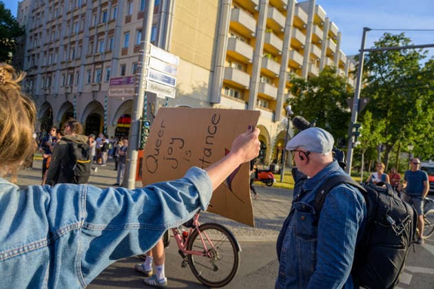 July 24, 2026, Berlin, Berlin, Germany: A person triew to block a journalist film with their placard, at Dyke* March 2026, on July 24 2026, in Berlin, Germany. Thousands of demonstrators marched in the streets of Berlin s City Center and Kreuzberg districts for the annual Dyke* March just a day before the annual CSD parade and Internationalist Queer Pride Berlin Germany - ZUMAk201 20260724_zip_k201_003 Copyright: xNikosxKanistrasx