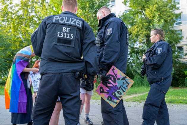 July 24, 2026, Berlin, Berlin, Germany: A police officer arrest one of the demonstrators because they hold a placard of a fist painted in the Palestine s flag colors at Dyke* March 2026, on July 24 2026, in Berlin, Germany. Thousands of demonstrators marched in the streets of Berlin s City Center and Kreuzberg districts for the annual Dyke* March just a day before the annual CSD parade and Internationalist Queer Pride Berlin Germany  - ZUMAk201 20260724_zip_k201_012 Copyright: xNikosxKanistrasx