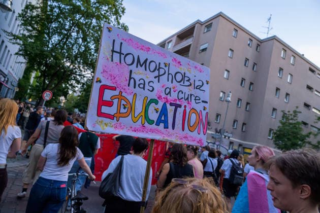 July 24, 2026, Berlin, Berlin, Germany: A person holds a placard against homophobia, at Dyke* March 2026, on July 24 2026, in Berlin, Germany. Thousands of demonstrators marched in the streets of Berlin s City Center and Kreuzberg districts for the annual Dyke* March just a day before the annual CSD parade and Internationalist Queer Pride Berlin Germany - ZUMAk201 20260724_zip_k201_020 Copyright: xNikosxKanistrasx