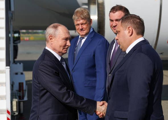 RUSSIA, OMSK - JULY 25, 2026: Russia s President Vladimir Putin greets officials on arrival at an airport. Putin (L) arrived in Omsk to participate in the 22nd Forum of Interregional Cooperation between Russia and Kazakhstan. From left to right: the Head of the FSB s Omsk Region Office, Dmitry Shishkoyedov, Omsk Region Governor Vitaly Khotsenko and the Presidential Plenipotentiary Envoy to the Siberian Federal District, Anatoly Seryshev. Vyacheslav Prokofyev Russian Presidential Press and Information Office TASS  95430814