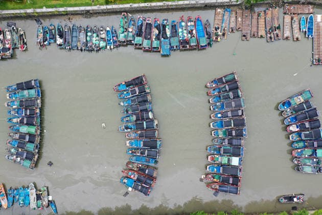 (260725) -- BEIJING, July 25, 2026 -- A drone photo taken on July 25, 2026 shows fishing boats taking shelter from the typhoon at a port in Shenzhen-Shanwei Special Cooperation Zone in south China s Guangdong Province. China s State Flood Control and Drought Relief Headquarters on Saturday raised its emergency response for flood and typhoon control in Guangdong Province to Level III as Typhoon Noul intensified, while activating a Level IV flood emergency response for Jiangxi and Hunan provinces. Typhoon Noul, the 12th typhoon of the year, is expected to make landfall along the coast between Hong Kong and Huilai in Guangdong Province between Saturday evening and Sunday morning. ) CHINA-TYPHOON NOUL-FISHING BOAT-SHELTERING (CN) LuxHanxin 