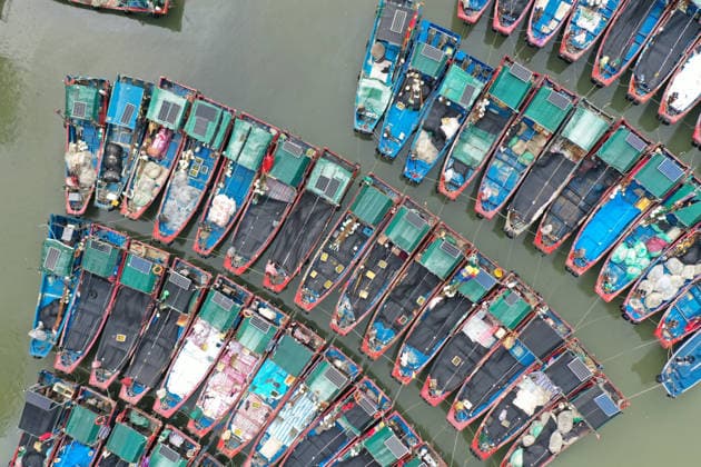(260725) -- BEIJING, July 25, 2026 -- A drone photo taken on July 25, 2026 shows fishing boats taking shelter from the typhoon at a port in Shenzhen-Shanwei Special Cooperation Zone in south China s Guangdong Province. China s State Flood Control and Drought Relief Headquarters on Saturday raised its emergency response for flood and typhoon control in Guangdong Province to Level III as Typhoon Noul intensified, while activating a Level IV flood emergency response for Jiangxi and Hunan provinces. Typhoon Noul, the 12th typhoon of the year, is expected to make landfall along the coast between Hong Kong and Huilai in Guangdong Province between Saturday evening and Sunday morning. ) CHINA-TYPHOON NOUL-FISHING BOAT-SHELTERING (CN) LuxHanxin 