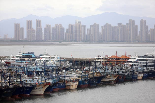 (260725) -- BEIJING, July 25, 2026 -- Fishing boats take shelter from the typhoon at a port in Xiamen, southeast China s Fujian Province, on July 25, 2026. China s State Flood Control and Drought Relief Headquarters on Saturday raised its emergency response for flood and typhoon control in Guangdong Province to Level III as Typhoon Noul intensified, while activating a Level IV flood emergency response for Jiangxi and Hunan provinces. Typhoon Noul, the 12th typhoon of the year, is expected to make landfall along the coast between Hong Kong and Huilai in Guangdong Province between Saturday evening and Sunday morning. (Photo by Xinhua) CHINA-TYPHOON NOUL-FISHING BOAT-SHELTERING (CN) ZengxDemeng 