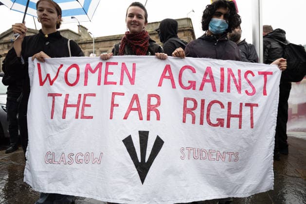July 25, 2026, Glasgow, Scotland, UK: Pro-immigration protesters aligned with Stand Up To Racism Scotland and other allied organisations hold placards and banners during a demonstration in Glasgow. The protest took place amid heightened tensions over immigration and asylum seekers following months of unrest and protests across Scotland and was met with a counter protest held by anti-immigration supporters. Glasgow UK  - ZUMAs357 20260725_zip_s357_003 Copyright: xCameronxScottx