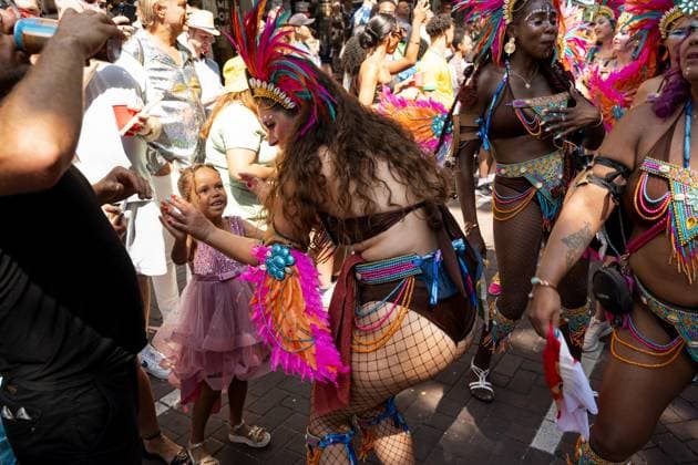 ROTTERDAM - Visitors and participants dance during the street parade of the Rotterdam Unlimited Summer Carnival. Carnival groups present their new themes with colorful costumes, choreographies, music, floats, and live percussion. LINA SELG ANP netherlands out - belgium out  Copyright: xx x564267060x originalFilename: 564267060.jpg