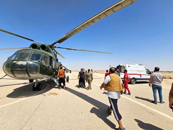 (260725) -- HOMS, July 25, 2026 -- An ambulance and a military helicopter prepare to transport the injured following a collision involving two passenger buses on the Damascus-Deir al-Zour highway in Homs province, Syria, July 25, 2026. The death toll from a collision involving two passenger buses on the Damascus-Deir al-Zour highway in central Syria on Saturday has risen to 35, Syrian state news agency SANA reported, citing a health official. ( Xinhua) (SpotNews) SYRIA-HOMS-BUS COLLISION Str 
