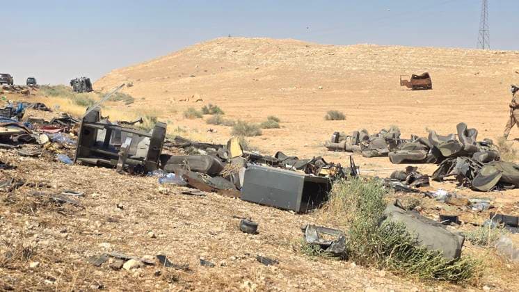 (260725) -- HOMS, July 25, 2026 -- This photo taken on July 25, 2026 shows the site of a collision involving two passenger buses on the Damascus-Deir al-Zour highway in Homs province, Syria. The death toll from a collision involving two passenger buses on the Damascus-Deir al-Zour highway in central Syria on Saturday has risen to 35, Syrian state news agency SANA reported, citing a health official. ( Xinhua) (SpotNews) SYRIA-HOMS-BUS COLLISION Str 