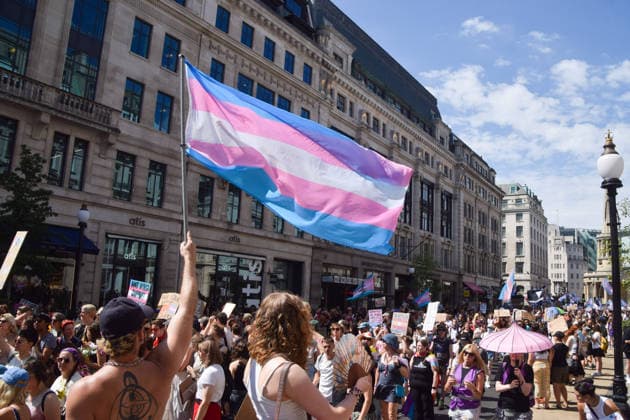 July 25, 2026, London, England, United Kingdom: A participant holds a Trans Pride flag in Regent Street during Trans Pride 2026. London United Kingdom  - ZUMAv130 20260725_zip_v130_039 Copyright: xVukxValcicx