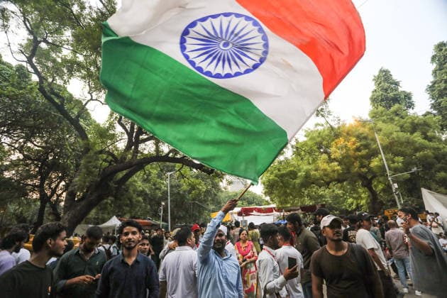 CJP supporters at the protest site following the resignation of Union Education Minister Dharmendra Pradhan New Delhi, Jul 25 (ANI): A CJP supporter waves the National flag at the protest site following the resignation of Union Education Minister Dharmendra Pradhan, in New Delhi on Saturday. New Delhi Delhi India Copyright: xANIx ANI_20260725468