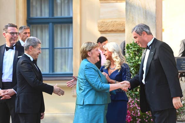 v.li:Markus BLUME (CSU,Bayerischer Staatsminister für Wissenschaft und Kunst), Joachim SAUER, Angela MERKEL ,Karin BAUMUELLER SOEDER;Markus SOEDER (Ministerpraesident Bayern und CSU Vorsitzender). Eroeffnung der Bayreuther Richard Wagner Festspiele 2026, Roter Teppich am 25.07.2026. Gruener Huegel, *** From left: Markus BLUME (CSU), Bavarian Minister of State for Science and the Arts; Joachim SAUER; Angela MERKEL; Karin BAUMUELLER; Markus SOEDER, Minister-President of Bavaria and CSU Chairman; Opening of the 2026 Bayreuth Richard Wagner Festival, Red carpet on July 25, 2026, at the Green Hill,