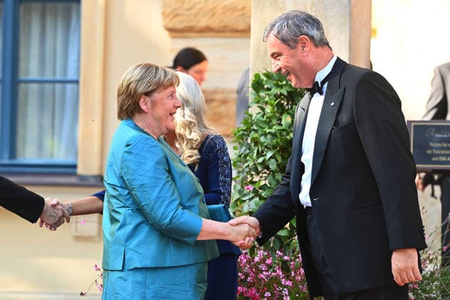 v.li: Angela MERKEL , Markus SOEDER (Ministerpraesident Bayern und CSU Vorsitzender). Eroeffnung der Bayreuther Richard Wagner Festspiele 2026, Roter Teppich am 25.07.2026. Gruener Huegel, *** From left: Angela MERKEL, Markus SOEDER, Minister-President of Bavaria and CSU Chairman; Opening of the 2026 Bayreuth Richard Wagner Festival; Red Carpet on July 25, 2026, at the Green Hill,