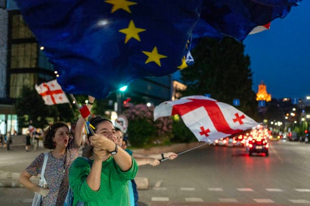 July 25, 2026, Tbilisi, Georgia: Protesters wave European Union and Georgian flags as they mark the 605th day of anti-government rally in Tbilisi, Georgia. Tbilisi Georgia - ZUMAz174 20260725_zip_z174_001 Copyright: xMoexZoyarix