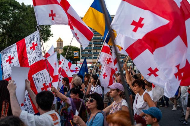 July 25, 2026, Tbilisi, Georgia: Protesters carry Georgian flags as they mark the 605th day of anti-government rally in Tbilisi, Georgia. Tbilisi Georgia - ZUMAz174 20260725_zip_z174_003 Copyright: xMoexZoyarix