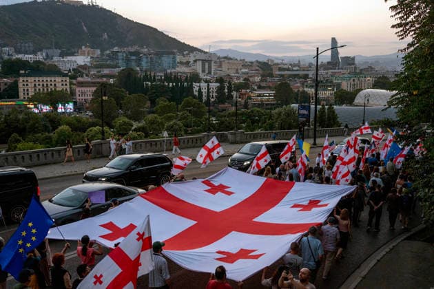 July 25, 2026, Tbilisi, Georgia: Protesters carry Georgian flags as they mark the 605th day of anti-government rally in Tbilisi, Georgia. Tbilisi Georgia - ZUMAz174 20260725_zip_z174_006 Copyright: xMoexZoyarix