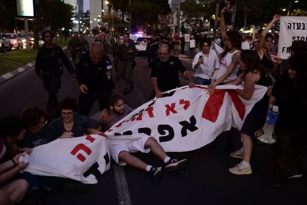 July 25, 2026, Tel-Aviv, Israel: TEL AVIV, ISRAEL Ã¢â‚¬ JULY 25, 2026: Dozens of protesters gather outside Israeli military headquarters (Kirya) in Tel Aviv to demonstrate against ongoing settler violence targeting Palestinians in the occupied West Bank. Clashes broke out with police after some demonstrators attempted to block the road. Tel-Aviv Israel  - ZUMAq101 20260725_zna_q101_218 Copyright: xTomerxNeubergx