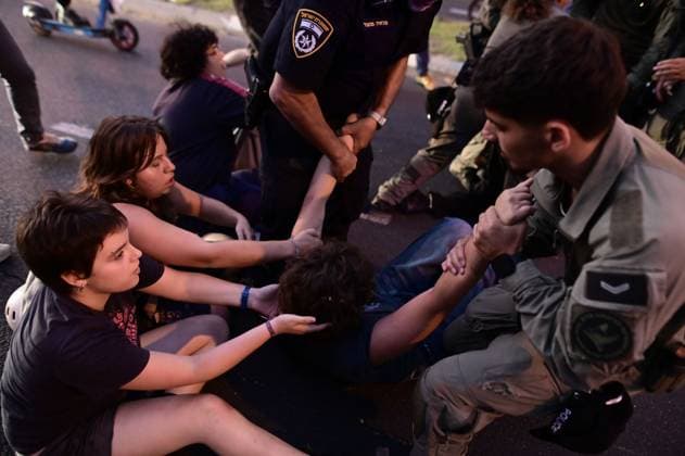 July 25, 2026, Tel-Aviv, Israel: TEL AVIV, ISRAEL Ã¢â‚¬ JULY 25, 2026: Dozens of protesters gather outside Israeli military headquarters (Kirya) in Tel Aviv to demonstrate against ongoing settler violence targeting Palestinians in the occupied West Bank. Clashes broke out with police after some demonstrators attempted to block the road. Tel-Aviv Israel - ZUMAq101 20260725_zna_q101_244 Copyright: xTomerxNeubergx