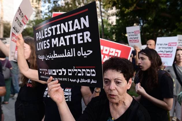 July 25, 2026, Tel-Aviv, Israel: TEL AVIV, ISRAEL Ã¢â‚¬ JULY 25, 2026: Dozens of protesters gather outside Israeli military headquarters (Kirya) in Tel Aviv to demonstrate against ongoing settler violence targeting Palestinians in the occupied West Bank. Clashes broke out with police after some demonstrators attempted to block the road. Tel-Aviv Israel - ZUMAq101 20260725_zna_q101_252 Copyright: xTomerxNeubergx