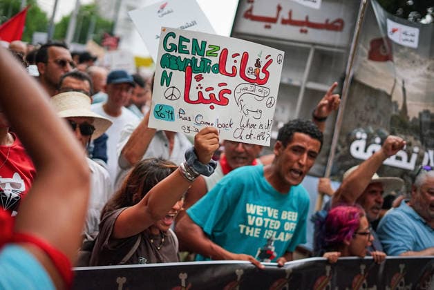 July 25, 2026, Tunis, Tunis, Tunisia, Tunisia: People hold placards and chant slogans during a protest against Tunisian President Kais Saied in downtown Tunis, Tunisia, on July 25, 2026. Demonstrators gathered on Republic Day to denounce the government s handling of prolonged power outages and recurring water cuts affecting regions across the country, while also criticizing President Saied s rule and demanding political and economic reforms. Tunis Tunisia - ZUMAm342 20260725_zsp_m342_009 Copyright: xHasanxMradx