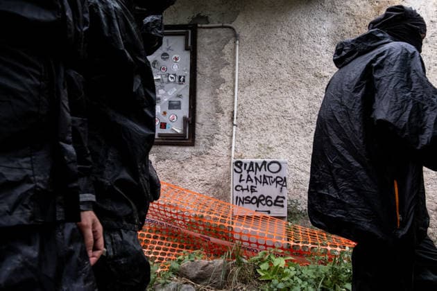 July 25, 2026, Susa, Piedmont, Italy: On July 25, 2026, thousands of people departed from AltaFelicito , a music festival in Venaus, to reach the construction sites of the TAV (High speed rail), a railway project to connect Italy and France. The demonstrators managed to enter the site and there clashed with the police, who responded with tear gas. Many of the buildings inside were put on fire, including two police vehicles. The TAV project has been highly contested during the last 30 years because of environmental damages and increasing costs. Susa Italy  - ZUMAs377 20260725_znp_s377_009 Copyright: xPietroxStariccox