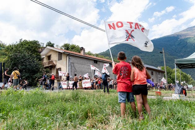 July 25, 2026, Susa, Piedmont, Italy: On July 25, 2026, thousands of people departed from AltaFelicito , a music festival in Venaus, to reach the construction sites of the TAV (High speed rail), a railway project to connect Italy and France. The demonstrators managed to enter the site and there clashed with the police, who responded with tear gas. Many of the buildings inside were put on fire, including two police vehicles. The TAV project has been highly contested during the last 30 years because of environmental damages and increasing costs. Susa Italy  - ZUMAs377 20260725_znp_s377_013 Copyright: xPietroxStariccox